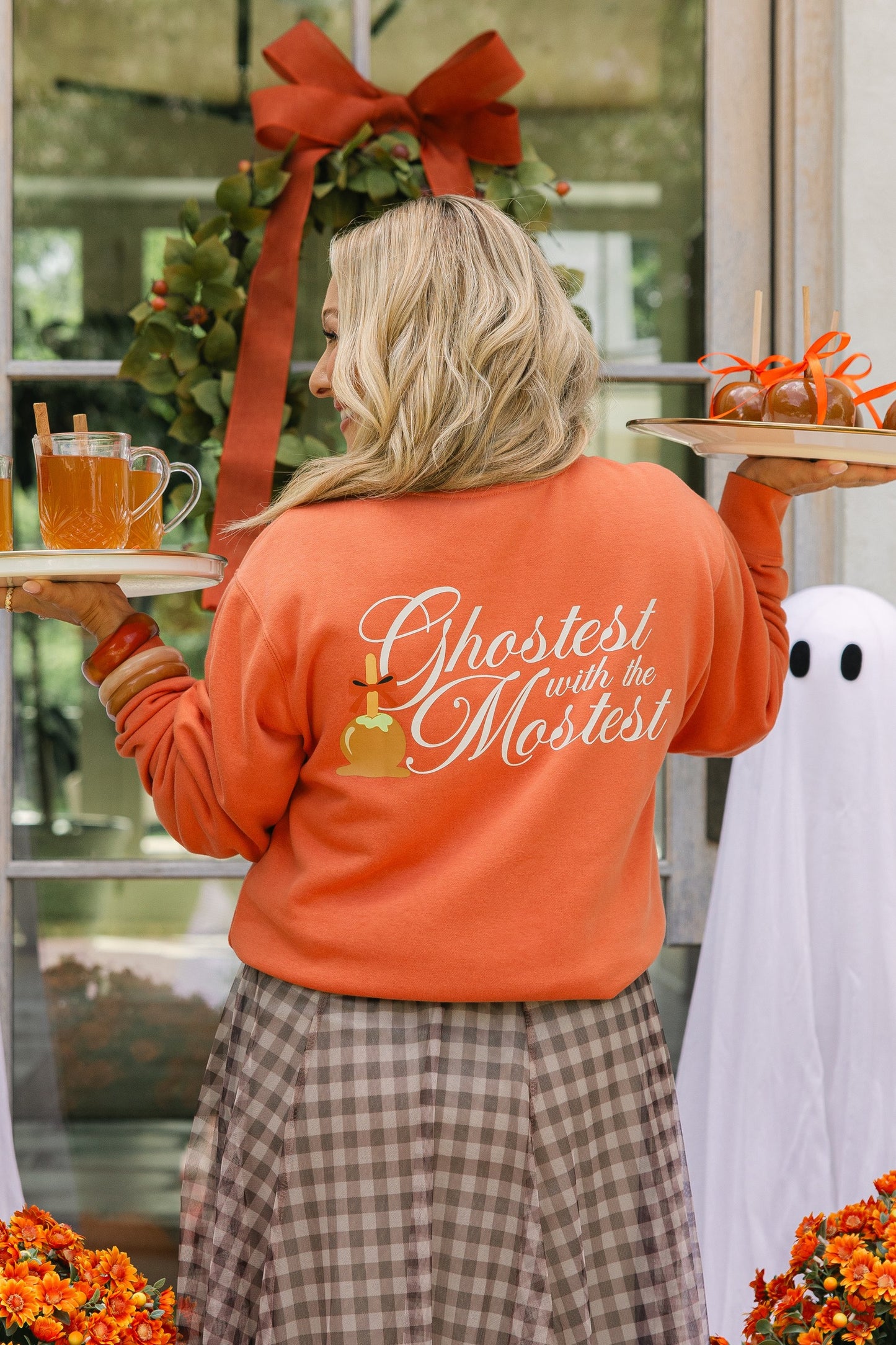 Orange sweatshirt saying ghostest with the mostest