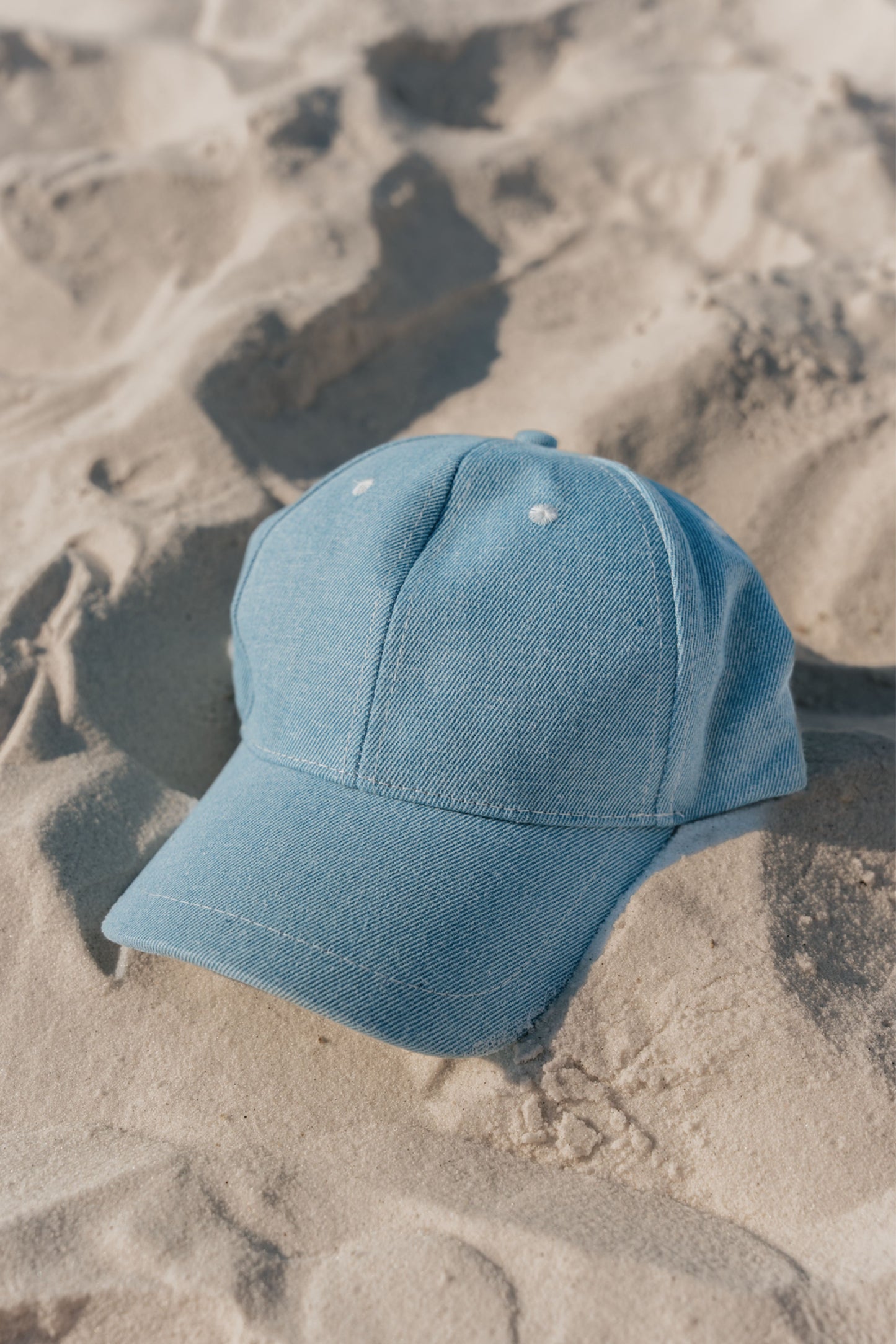 Blue cap on sand