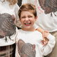 family in turkey sweatshirts 