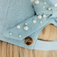 Light blue denim hat with pearls and a gold 'Lfco' logo on a denim surface.