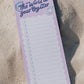 Notepad with 'The World is Your Oyster' text on a sandy background