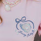 Pink shirt with a blue graphic and text 'Living Fully Co' worn by a person.